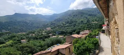 a view of a town in a valley with mountains at The Charming House in Ville-di-Paraso