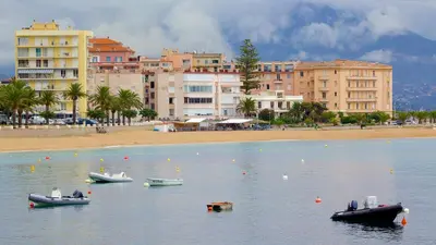 a group of boats in the water near a beach at Beau studio proche centre ville et plage in Ajaccio