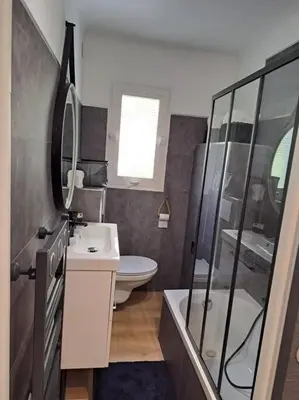 a bathroom with a toilet and a sink and a shower at Beau studio proche centre ville et plage in Ajaccio