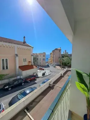 a view of a city street from a balcony at Beau studio proche centre ville et plage in Ajaccio