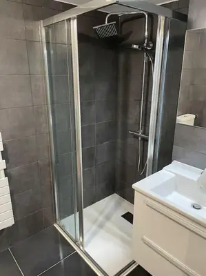 a bathroom with a shower and a sink at Parking gratuit grande terrasse Proche Centre Ville in Ajaccio