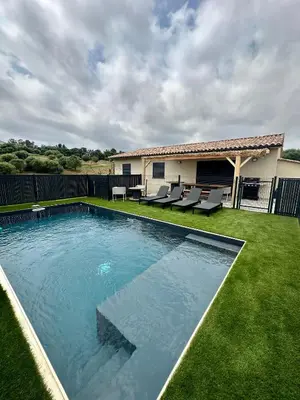 a swimming pool in the yard of a house at Casa Lamaghjone - Villa T4 avec piscine chauffée à 3,5km de la mer in Aléria