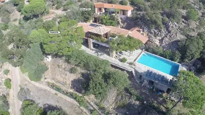 an aerial view of a house with a swimming pool at Galate in Porto-Vecchio