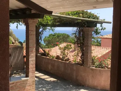 a view of the ocean from the patio of a house at Galate in Porto-Vecchio
