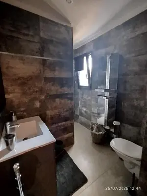 a bathroom with a sink and a toilet at VILLA entre mer, montagnes, étangs et rivières in Ventiseri