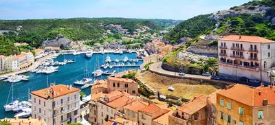 an aerial view of a harbor with boats in the water at VILLA entre mer, montagnes, étangs et rivières in Ventiseri