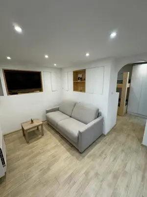 a living room with a couch and a table at Appartement moderne Santa Giulia in Porto-Vecchio