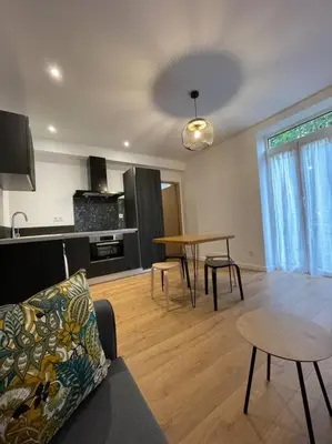 a living room with a couch and a table at Appartement centre ville Corte (F) in Corte