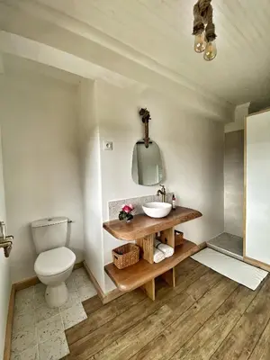 a bathroom with a toilet and a sink at U PASTURELLU in Pioggiola