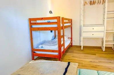 a bedroom with two bunk beds in a room at Marina - Exceptional Sea View Ruppione - by TGB in Pietrosella