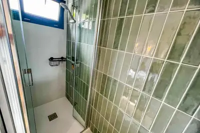 a bathroom with a shower with a glass door at Marina - Exceptional Sea View Ruppione - by TGB in Pietrosella