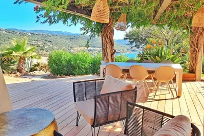 a patio with a table and chairs and a view at Marina - Exceptional Sea View Ruppione - by TGB in Pietrosella