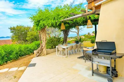 a patio with a grill and a table and chairs at Marina - Exceptional Sea View Ruppione - by TGB in Pietrosella