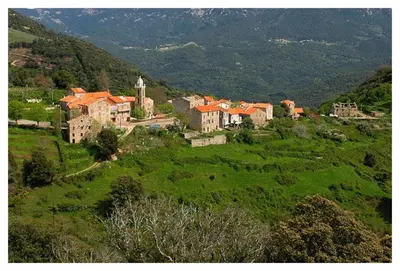 a small village on a green hill with houses at Casadimela in Mela