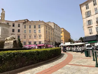 a city street with a statue and buildings at Appartement COSY centre Ajaccio in Ajaccio