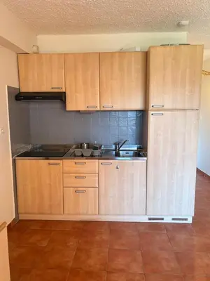 a living room with a couch and a table at Appartement, 60m2, 6 couchages avec piscines à Marine de Bravone, Linguizetta, résidence Sognu Di mare Corse in Linguizzetta