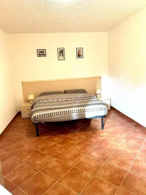 a living room with a couch and a coffee table at Appartement, 60m2, 6 couchages avec piscines à Marine de Bravone, Linguizetta, résidence Sognu Di mare Corse in Linguizzetta