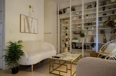 a living room with a couch and a table at Casamea - Apt Spacieux, Clim, Famille & Cabane in Ajaccio