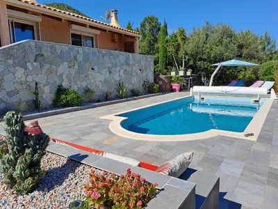 a backyard with a swimming pool and a house at Villa Cutalello coté montagne Calenzana in Calenzana