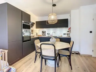 a kitchen and dining room with a table and chairs at CAPO FENO AJACCIO in Ajaccio