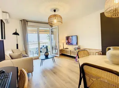 a living room with a couch and a table at CAPO FENO AJACCIO in Ajaccio