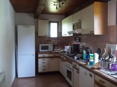 a kitchen with white appliances and a white refrigerator at QUIET COTTAGE NEAR CITY CENTER in Porto-Vecchio