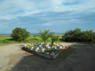 a rock garden in the middle of a road at La Corse mer turquoise et sable fin in Poggio-Mezzana