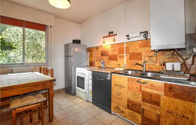 a kitchen with a sink and a counter top at Cozy Apartment In Ajaccio With Wifi in Ajaccio