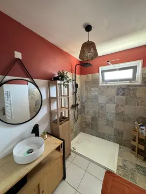 a bathroom with a sink and a mirror at T3 Cosy in Ajaccio
