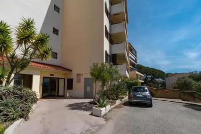 a car parked in front of a building at Les crêtes , magnifique T2 4 pers Route des Sanguinaires in Ajaccio