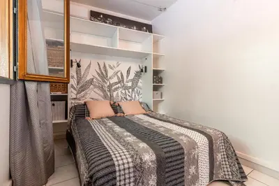 a bedroom with a bed in a room at Les crêtes , magnifique T2 4 pers Route des Sanguinaires in Ajaccio