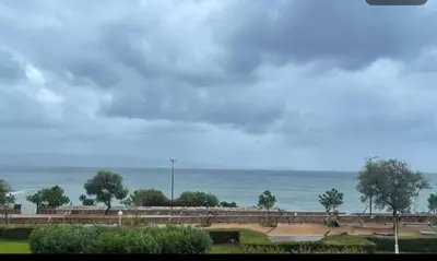 a view of the ocean on a cloudy day at Superbe Pieds dans l eau ajaccio face à la mer plage de sable fin route des îles des sanguinaires in Ajaccio