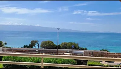 a view of the ocean from a highway at Superbe Pieds dans l eau ajaccio face à la mer plage de sable fin route des îles des sanguinaires in Ajaccio