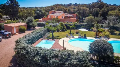 an aerial view of a house with a swimming pool at Residence Les Jardins de Sainte-Lucie 