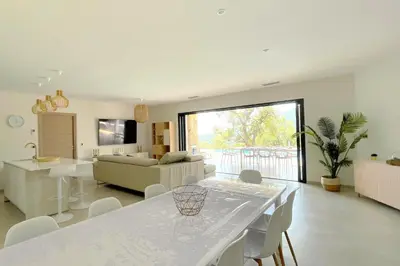 a living room with a white table and a couch at Villa Concarella Di Conca in Conca