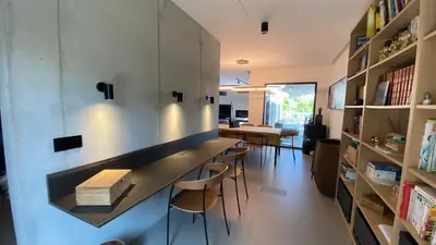 a kitchen and dining room with a table and chairs at Villa A Licciola in Porto-Vecchio
