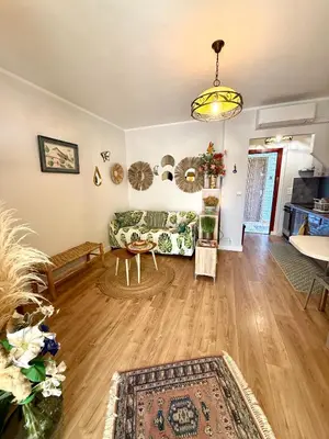 a bedroom with a bed and a living room at Casa Marana in Borgo