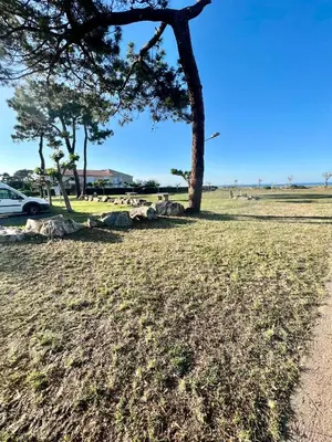 a sandy beach with the ocean in the background at Casa Marana in Borgo