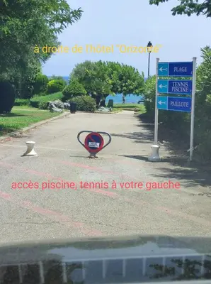 a sign in the middle of a road at A 5 mn à pied de la mer, piscine ,tennis, paillote in Cervione