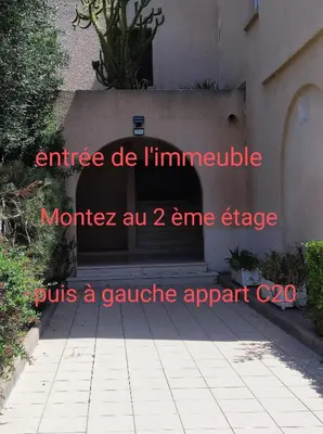 a sign that is on the side of a building at A 5 mn à pied de la mer, piscine ,tennis, paillote in Cervione