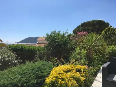 a garden with colorful flowers and plants at Appartement Marina di Fiori by Intendance Excellency in Porto-Vecchio