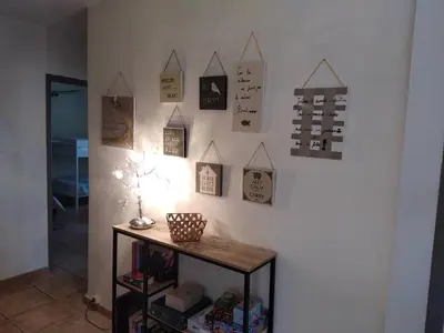 a room with a wall with signs on the wall at Rez Haut de villa à Calenzana in Calenzana