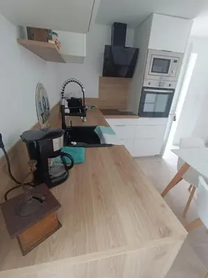 a kitchen with a wooden counter top in a room at Maison de charme proche Bastia in Prunelli-di-Casacconi