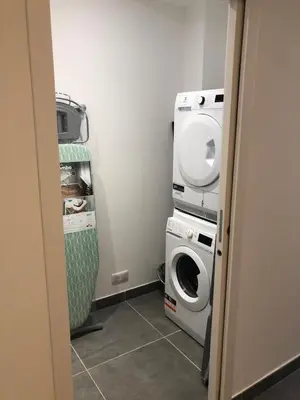 a laundry room with a washing machine and a washer at Casa campa lumba in Propriano