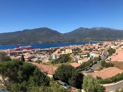a view of a town and a body of water at Casa campa lumba in Propriano