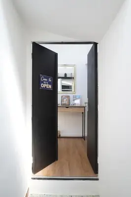 an open door to a room with a desk in it at F2 Type LOFT à Ajaccio in Ajaccio