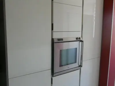 a refrigerator with a tv on the side of it at Le Rocher Des Sanguinaires in Ajaccio