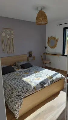 a bedroom with a large bed in a room at Casa corsica in Pianottoli-Caldarello