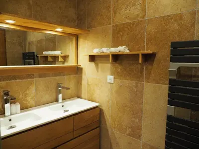 a bathroom with a sink and a mirror at MAMMONA in Bonifacio