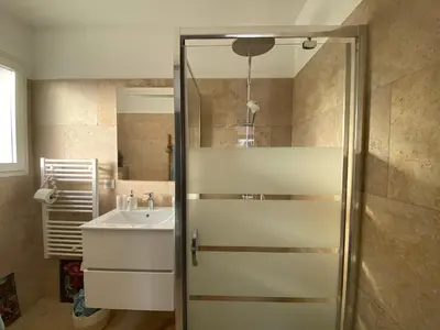 a bathroom with a shower and a sink at Villa Vittoria in Ghisonaccia